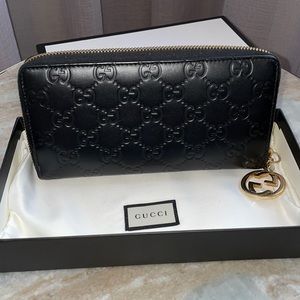 Gucci embossed leather zip around wallet